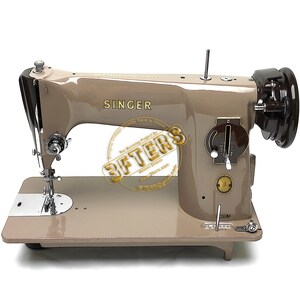 May include: A vintage Singer sewing machine in a tan color scheme. The machine features the Singer logo and various mechanical components. The image also includes text from "3FTERS" and their website.