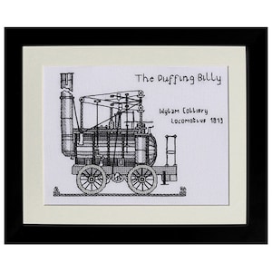 May include: A framed black and white illustration of the Puffing Billy, a Wylam Colliery locomotive from 1813. The detailed drawing shows the engine's boiler, wheels, and mechanical components. The artwork is set against a cream background.