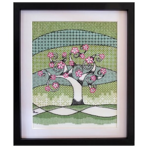 May include: A framed cross-stitch embroidery depicting a stylised tree with pink flowers and green leaves. The background is a green and blue geometric pattern.