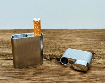 The Dugout - An elegant one hitter dugout box machined for the classy among us. Available in two sizes.