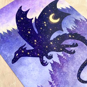 May include: A watercolor illustration of a dragon silhouetted against a purple and blue sky. The dragon's body is filled with stars and a crescent moon. The background features a forest of pine trees.