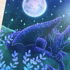 May include: A watercolor painting of a blue dragon sleeping under a full moon with stars in the night sky. The dragon is curled up with its head resting on its wing. The background is a dark blue with hints of green.