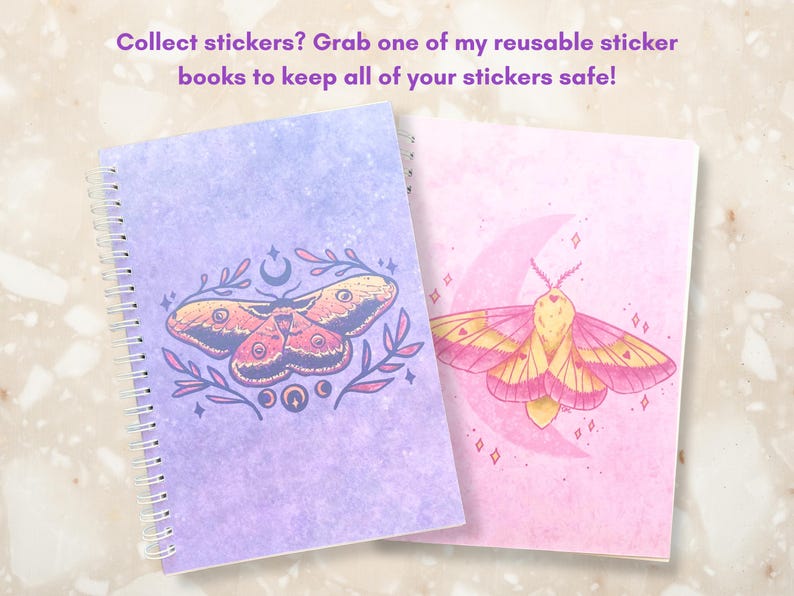 May include: Two spiral-bound sticker books. One is lavender with a moth and moon design, the other is pink with a moth and moon design. The text reads: Collect stickers? Grab one of my reusable sticker books to keep all of your stickers safe!