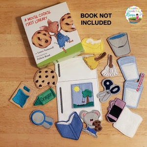 May include: A felt play set for the children's book "A Mouse Cookie First Library" by Laura Numeroff. The set includes felt cutouts of a mouse, a cookie, a book, a crayon, a magnifying glass, a tree, a bucket, a broom, a glass of milk, a pair of scissors, a pencil, and an eraser. The book cover is also included in the set.