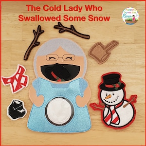 May include: A felt craft activity for kids featuring a lady with a blue dress and a snowman. The lady has a hole in her mouth where you can put the snowman's hat. The title of the craft is "The Cold Lady Who Swallowed Some Snow".