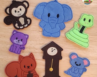 May include: A set of felt finger puppets featuring a monkey, elephant, snake, cat, squirrel, mouse, and a grandfather clock. The puppets are all brightly colored and have friendly faces.