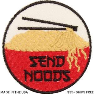 May include: Embroidered patch featuring a bowl of noodles with chopsticks. The bowl is red, the noodles are yellow, and the text "SEND NOODS" is in black. The patch is circular with a white background.