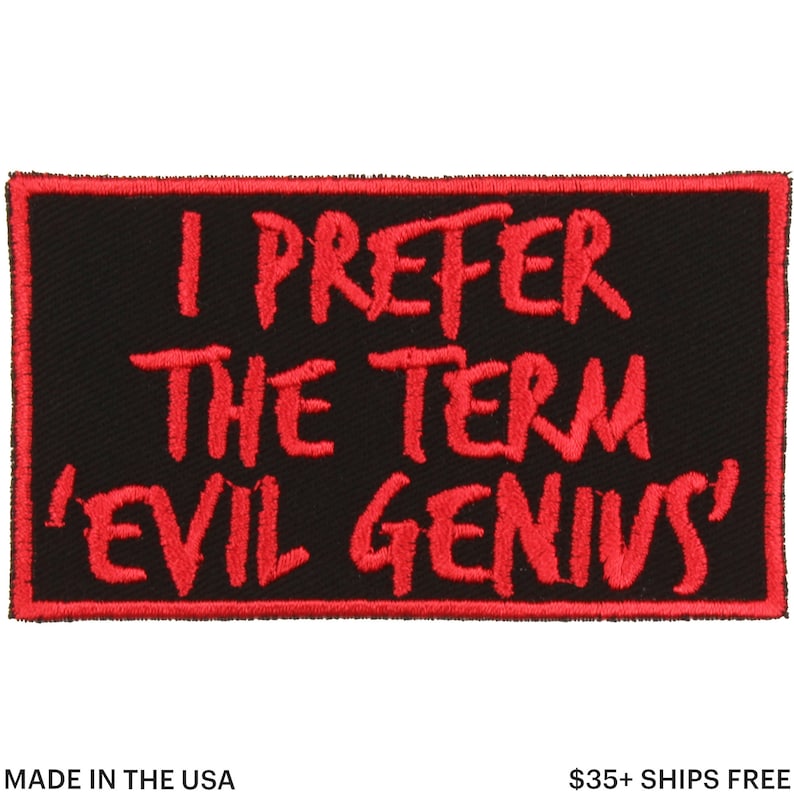 May include: Black rectangular patch with red embroidered text that reads "I PREFER THE TERM 'EVIL GENIUS'". The patch is bordered with red stitching and includes the text "MADE IN THE USA".