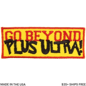 May include: Embroidered patch with the words "GO BEYOND PLUS ULTRA!" in red and black on a yellow background. The patch has a red border and is rectangular in shape. The text is bold and easy to read.
