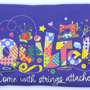 May include: Purple t-shirt with a colorful patchwork design that spells out "quilter" and the text "Come with strings attached".