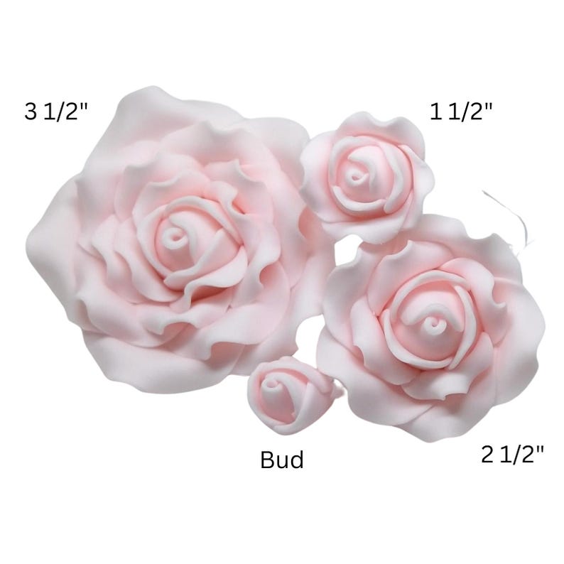 May include: Pale pink artificial roses in various sizes. The largest rose measures 3 1/2 inches, with others at 2 1/2 inches and 1 1/2 inches. A bud is also included. These decorative flowers are ideal for crafting or event decor.
