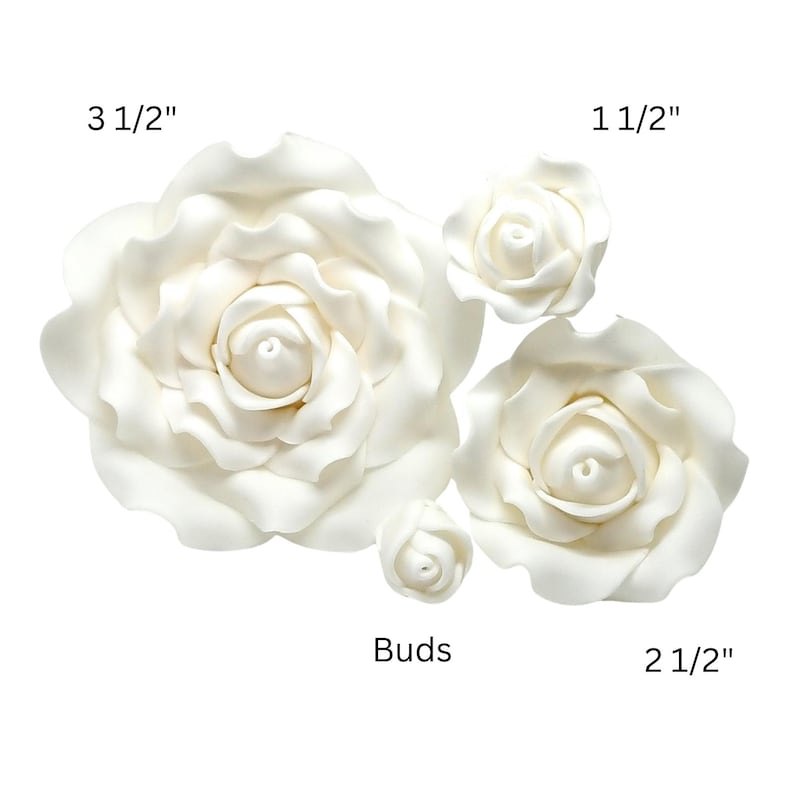 May include: An assortment of white rose blossoms and buds. The largest flower measures 3 1/2 inches, with others at 2 1/2 inches and 1 1/2 inches. The buds are also included. These flowers are ideal for crafting and decorative projects.