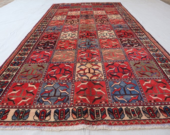 4'10 x 9'3 Hand knotted Tribal Vintage wool rug