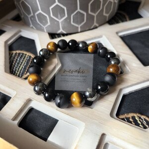 Health Energy Bracelet. Combination of Hematite, Tiger Eye and Obsidian (Matte) combine to bring a protective punch.