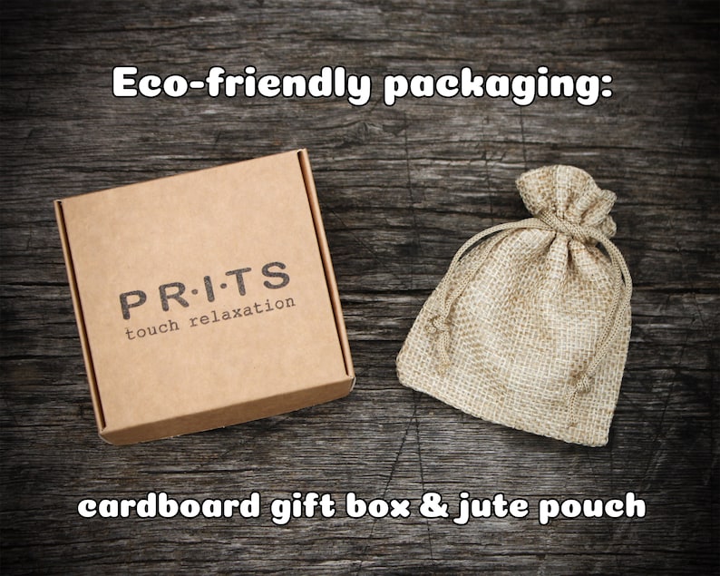 May include: Eco-friendly packaging for a product called "PR.I.TS touch relaxation". The packaging includes a cardboard gift box and a jute pouch.