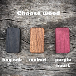 May include: Three wood samples: bog oak, walnut, and purple heart. Choose your wood type.