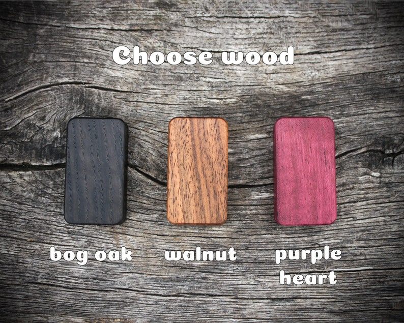May include: Three wood samples: bog oak, walnut, and purple heart. Choose your wood type.