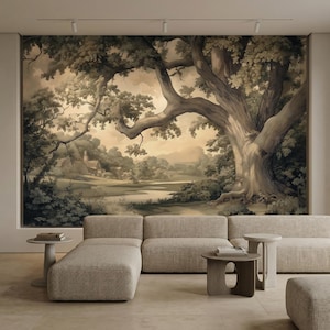 May include: A sepia-toned landscape mural featuring a large tree as the focal point. The artwork shows a detailed forest, a small building, and a body of water. The mural is mounted on a wall above a modern, neutral-toned sectional sofa.