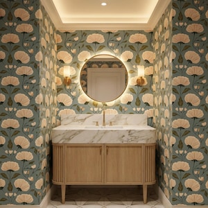 May include: A bathroom interior featuring a light wood vanity with a marble countertop and gold fixtures. A round, illuminated mirror hangs above the sink. The walls are covered in a floral wallpaper with a teal background and cream-colored flowers.