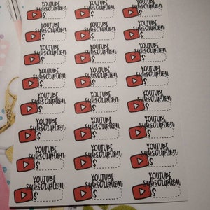 May include: A sheet of 20 red and white stickers with a play button icon and the text "YOUTUBE subscription $." The stickers are on a white background.