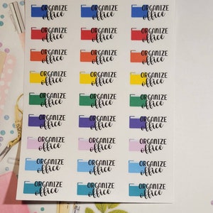 May include: A sheet of colorful stickers with the text "Organize Office" repeated 18 times. The stickers are in various colors, including blue, red, orange, yellow, green, purple, pink, and light blue.