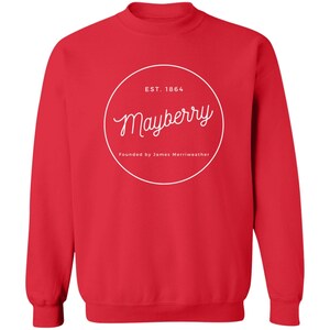 May include: Red sweatshirt with a white circle logo that says "Est. 1864 Mayberry Founded by James Merriweather"
