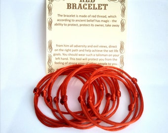 May include: A set of ten red string bracelets, also known as red string of fate bracelets. The bracelets are made of red thread and have a knot at the end. The bracelets are on a white background. The text on the card reads: "Red Bracelet. The bracelet is made of red thread, which according to ancient belief has magic - the ability to protect, protect its owner, take away from him all adversity and evil views, direct on the right path and help achieve the set life goals. You should wear such a talisman on your left hand. This tool will protect you from the feeling of strong envy of other people to you."