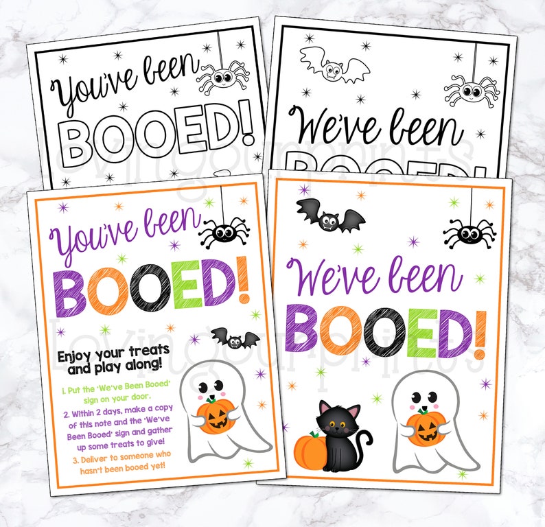 May include: Two printable Halloween "You've Been Booed!" signs with instructions on how to play the game. The signs feature ghosts, bats, spiders, and a black cat.