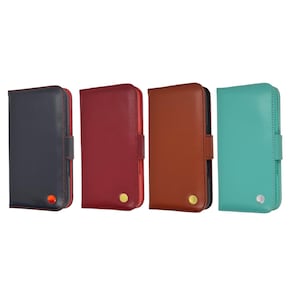 May include: Four leather phone cases in different colors: navy blue, burgundy, brown, and teal. Each case has a snap closure and a small, round accent. The cases are upright and displayed against a white background.