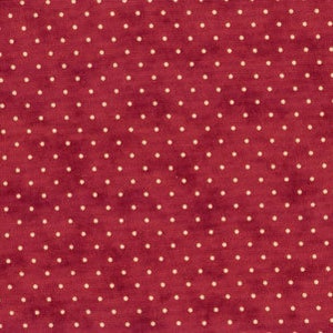 May include: Red fabric with a white polka dot pattern.