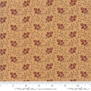 May include: A beige fabric with a repeating pattern of brown leaves and white berries. The fabric has a subtle texture and a vintage feel.