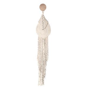 May include: A white macrame wall hanging with a circular design and long fringe. The hanging is attached to a wooden dowel.