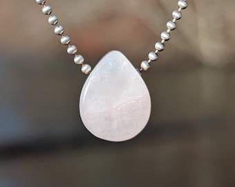 Petalite from Nambia hand carved into a teardrop shaped pendant to wear alone or use in your own diy jewelry