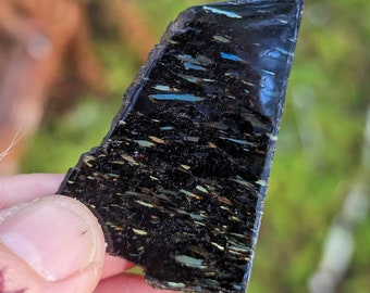 Rare Museum Quality Greenland Nuummite with fantastic displays of all the colours it has to offer as well as a rare inclusion