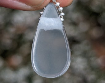 Light pink Rose Quartz hand carved into a raindrop shaped charm for a necklace or your own diy jewelry making and beading
