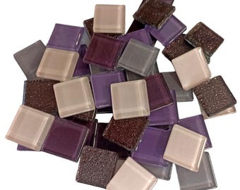 May include: A collection of square mosaic tiles in shades of purple, brown, and beige. Some tiles have a textured, speckled appearance, while others are smooth and translucent. The word "Mix" is visible in the bottom right corner.