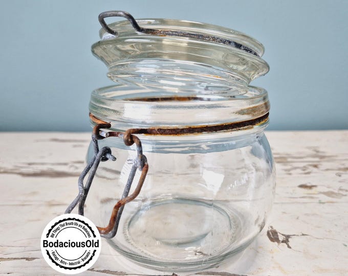 Vintage glass preserving jar with metal clasp