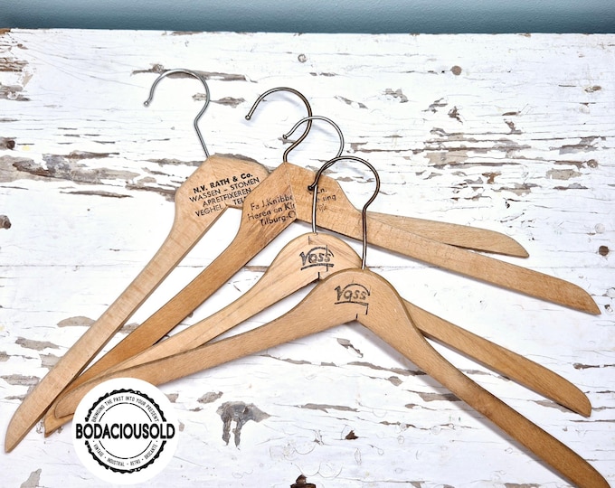 Vintage wooden hangers set | Retro printed coat hangers Netherlands | Antique store display 1950s