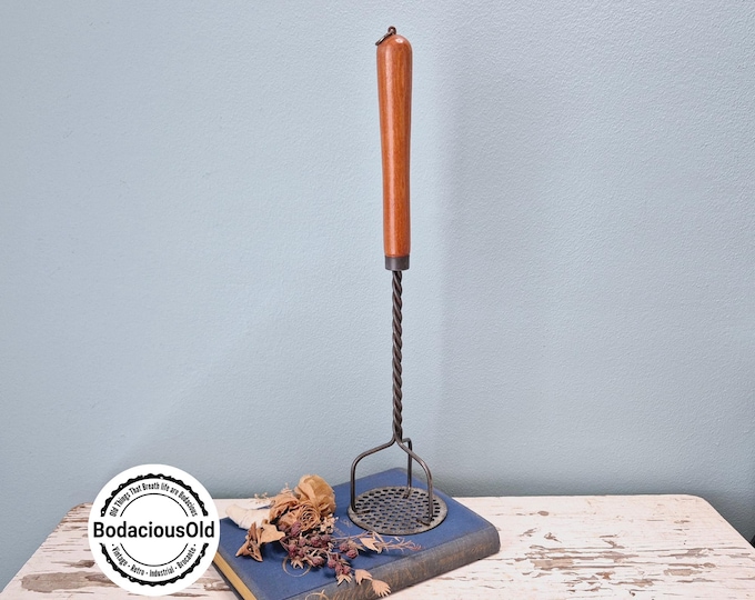 Vintage metal potato masher with wooden handle, rustic decorative Tomado Holland kitchen tool