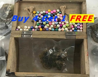 May include: A wooden treasure chest filled with colorful pearl beads. The chest is open and a single oyster is visible inside. The text "Buy 4 Get 1 FREE" is displayed on the image.