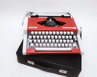 Máquina de escribir vintage Olympia Traveller DeLuxe, roja, años 70, con estuche