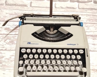 Vintage typewriter working Triumph-Adler, original suitcase, professionally serviced, latin keyboard layout