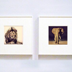 May include: Two framed animal prints, one of a lion and one of an elephant. The lion is lying down with its head raised, looking directly at the viewer. The elephant is standing with its trunk raised, looking directly at the viewer.