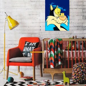 May include: A cartoon illustration of Sylvester the Cat and Tweety Bird. Sylvester is a large, black cat with a blue background. Tweety Bird is a small, yellow bird with a black outline. Sylvester is holding Tweety Bird in his mouth. The illustration is printed on a canvas and framed. The canvas is hanging on a white brick wall. There is a red armchair with a pillow that says 'I am what I am' in black text. There is a crib with a colorful blanket and a green giraffe toy. There is a multi-colored beanbag chair in the foreground.