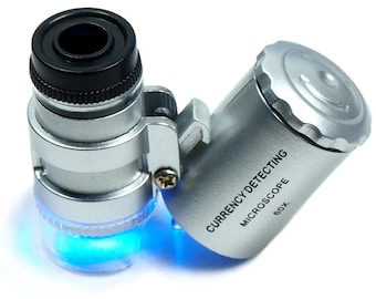 Mini lupa de joyero 60X con luces LED y fluorescentes ultravioleta.