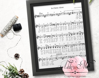 May include: A black and white printable sheet music for the Christian hymn "In Christ Alone". The lyrics are printed in a traditional hymn style font. The sheet music includes the lyrics, chords, and a key signature.