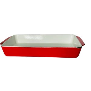 May include: A rectangular red baking dish with a white interior. The dish has a glossy finish and small handles on each end. This cookware is ideal for baking casseroles, roasting vegetables, and more.