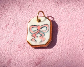 Hand-Painted Pink Ceramic Bow Pendant - Gold Luster Accent