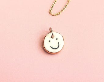 Double-Sided Ceramic Emotional Face Pendant: Gold Lustre Edge