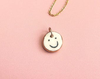 Double-Sided Ceramic Emotional Face Pendant: Gold Lustre Edge